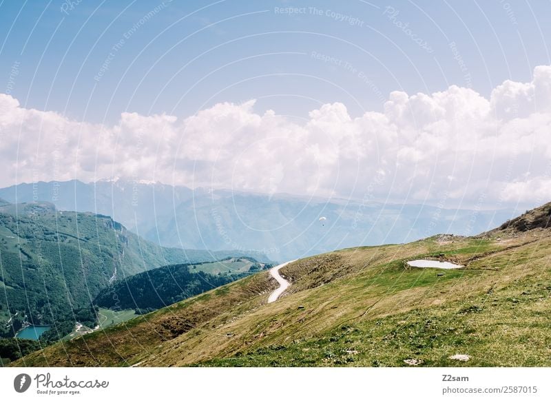 Monte Baldo Lake Garda. Environment Nature Landscape Sky Clouds Summer Beautiful weather Grass Alps Mountain Peak Sustainability Natural Blue Green Calm