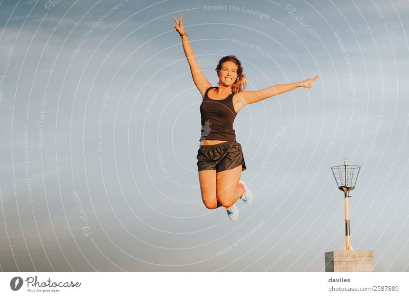 Athlete woman jumping and celebrating victory outdoors. Lifestyle Joy Wellness Summer Feasts & Celebrations Sports Sportsperson Success Human being Feminine