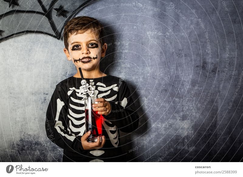 Little kid in a skeleton costume on Halloween Juice Joy Happy Beautiful Face Make-up Feasts & Celebrations Carnival Hallowe'en Fairs & Carnivals Child