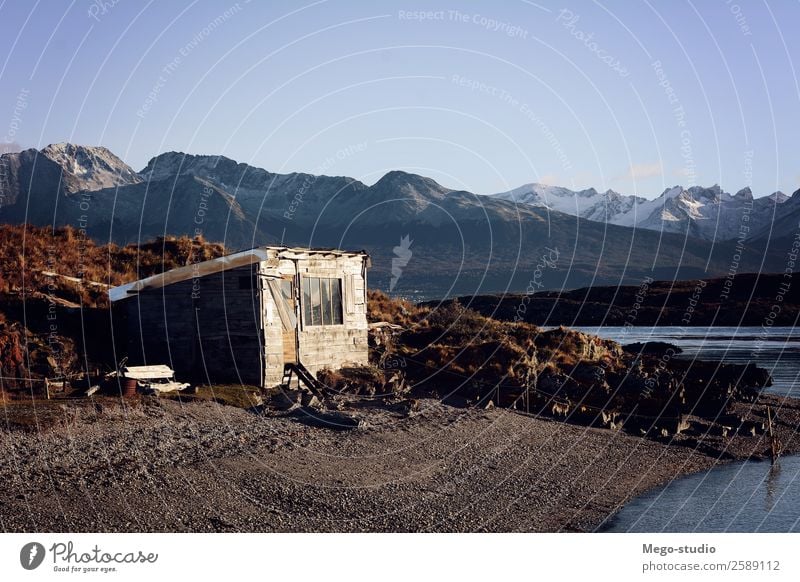 A wooden house near the river with mountains at back. Design Beautiful Relaxation Vacation & Travel Tourism Trip Mountain House (Residential Structure) Culture