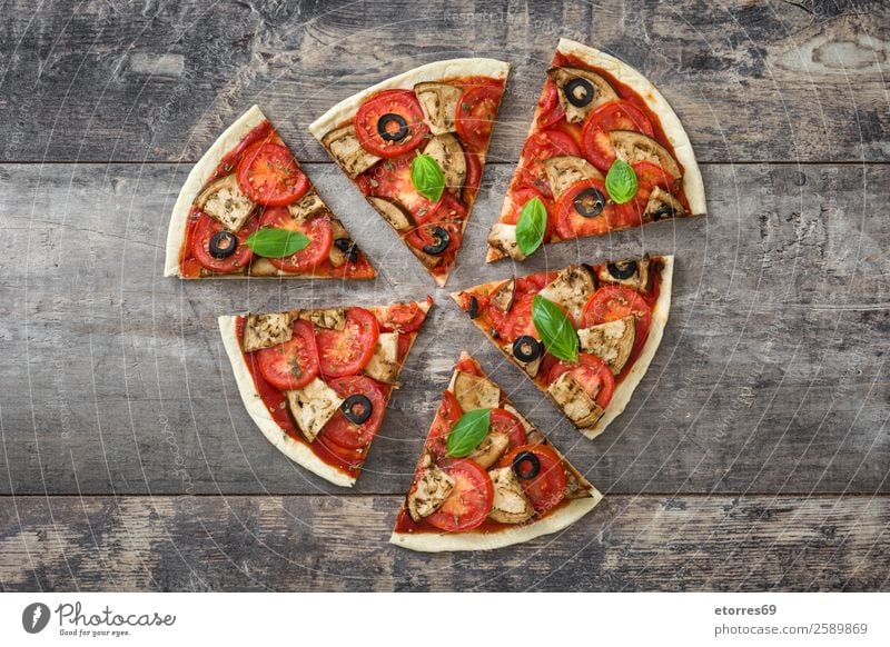 Vegetarian pizza slice. Top view. Pizza Vegetarian diet Vegan diet Tomato Aubergine Oregano Basil Olive Food Healthy Eating Food photograph Dish Slice Wood Take