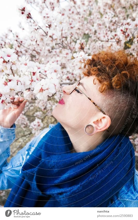 Young redhead woman surrounded by flowers Lifestyle Style Joy Happy Beautiful Hair and hairstyles Freedom Human being Feminine Young woman Youth (Young adults)