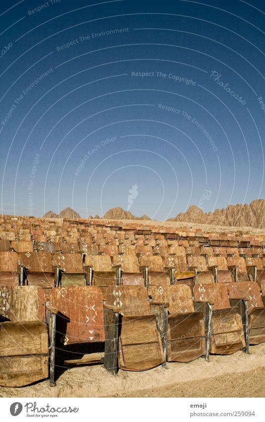 desert cinema Sky Cloudless sky Summer Desert Exceptional Blue Cinema Nature Exterior shot Seat Row of seats Movie hall Dry Colour photo Deserted Copy Space top