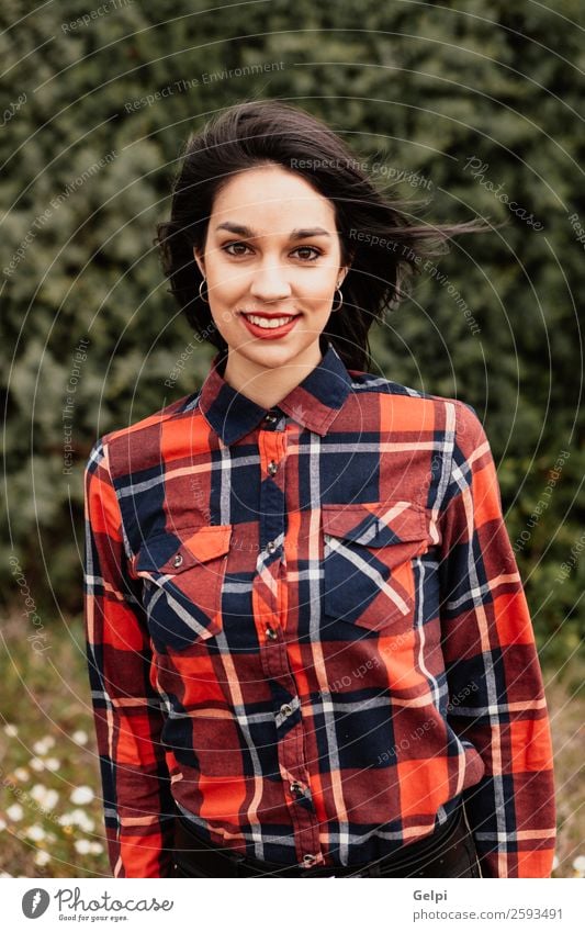 Pretty brunette girl Style Happy Beautiful Face Wellness Human being Woman Adults Lips Nature Flower Park Fashion Jacket Leather Brunette Smiling Happiness Long