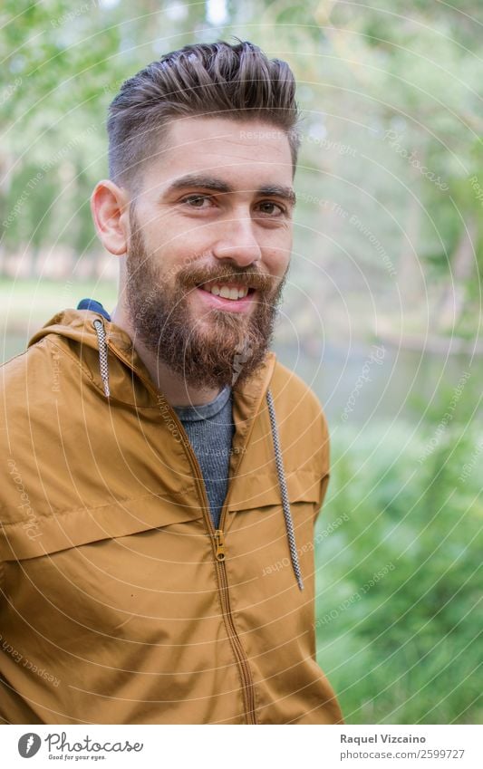 Man with coat, smiling. Wellness Winter Young man Youth (Young adults) 1 Human being 18 - 30 years Adults Nature Beautiful weather Bushes Field Forest Jacket