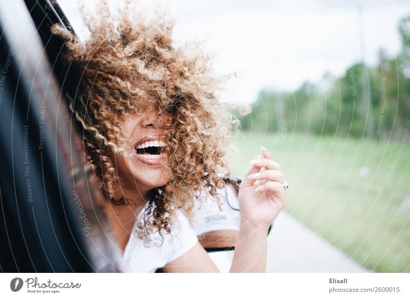 Happy woman with curly hair riding in car laughing Lifestyle Joy Human being Feminine 1 Emotions Moody Happiness Contentment Joie de vivre (Vitality)