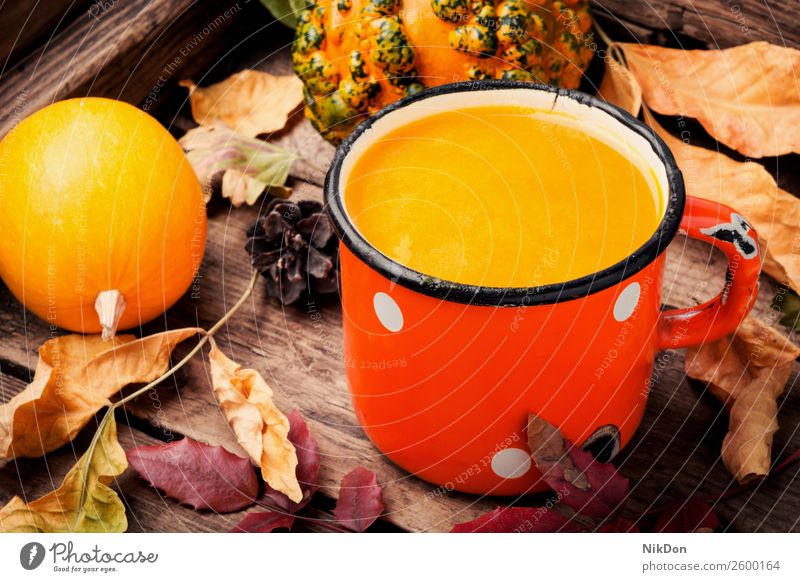 Healthy pumpkin smoothie drink autumn fall food vegetable metal fallen leaves mug beverage healthy orange fresh vegetarian sweet cocktail juice dessert rustic