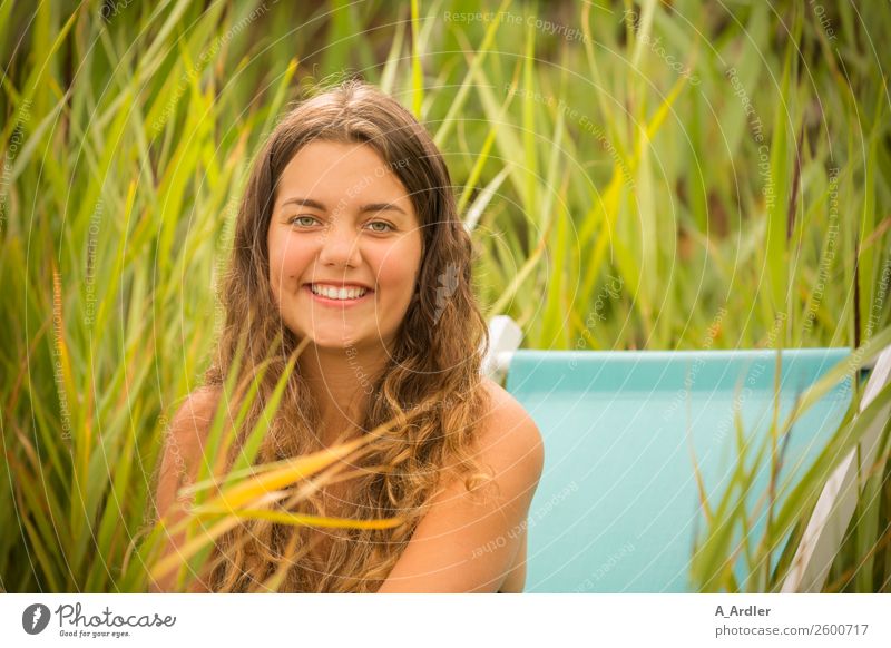 With the deck chair on the beach Clock Human being Feminine Young woman Youth (Young adults) 1 18 - 30 years Adults Nature Landscape Summer Beautiful weather