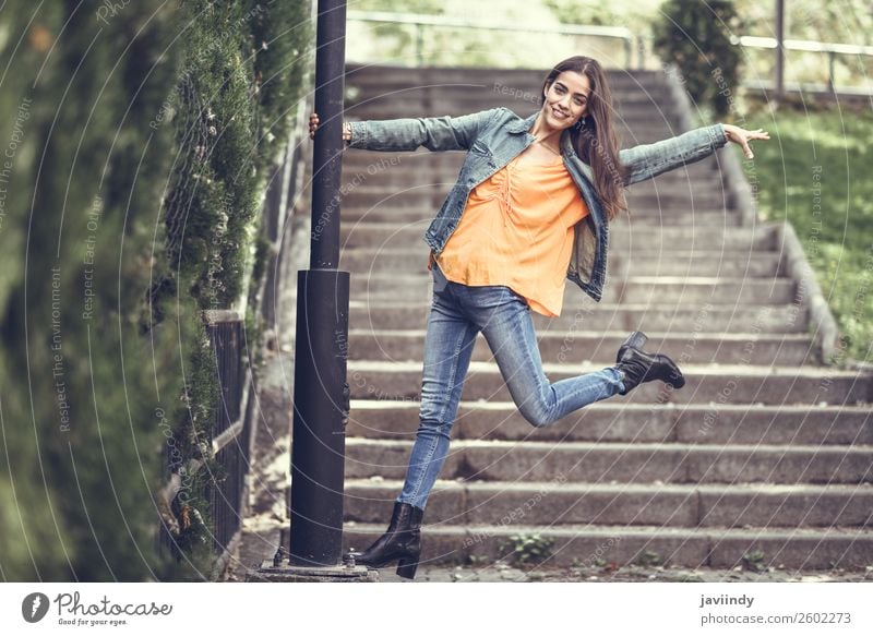 Young woman with nice hair wearing casual clothes in urban background. Lifestyle Style Happy Beautiful Hair and hairstyles Human being Feminine