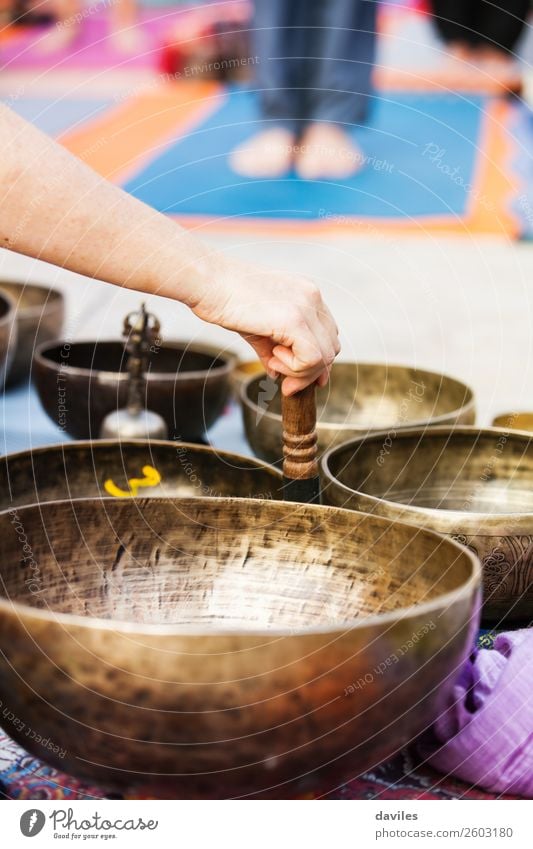 Tibetan bowls sound. Bowl Lifestyle Wellness Harmonious Well-being Relaxation Meditation Music Yoga Human being Hand 1 Street Metal Movement Playing Energy