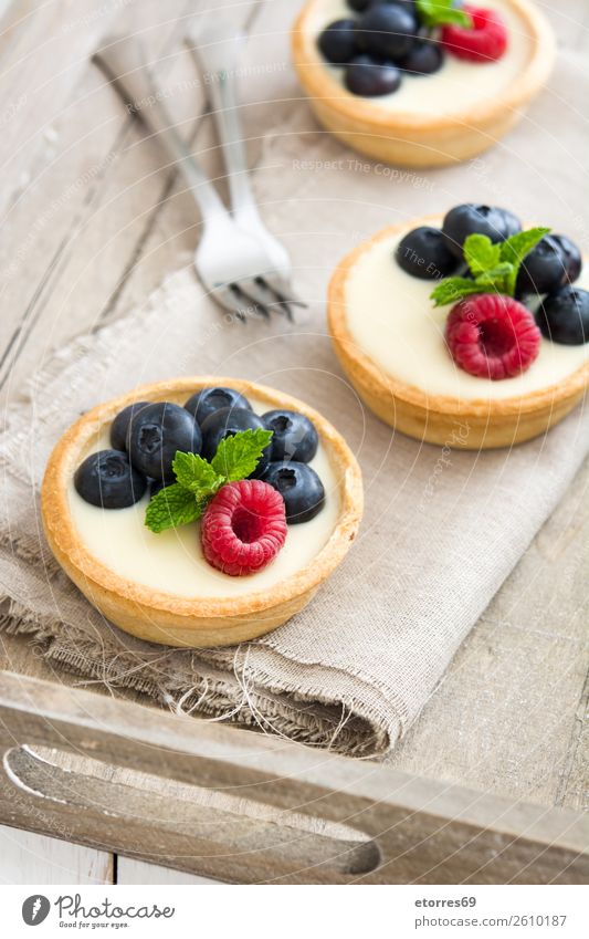 Delicious tartlets with raspberries and blueberries Tartlet Blueberry Raspberry Fruit Dessert Food Healthy Eating Food photograph Dish Cream custard Snack