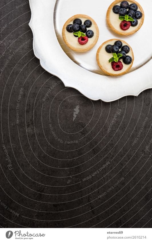 Delicious tartlets with raspberries and blueberries Tartlet Blueberry Raspberry Fruit Dessert Food Healthy Eating Food photograph Dish Cream custard Snack