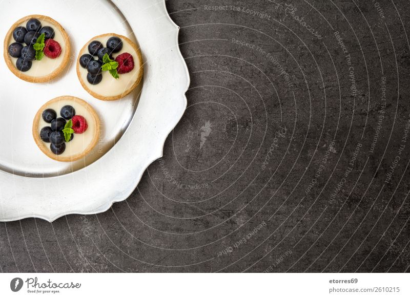 Delicious tartlets with raspberries and blueberries Tartlet Blueberry Raspberry Fruit Dessert Food Healthy Eating Food photograph Dish Cream custard Snack