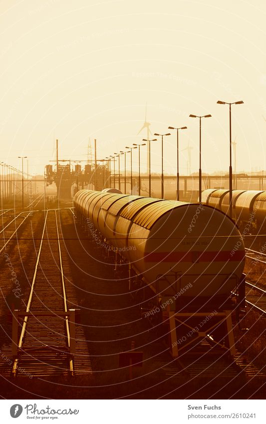 Iron Mad Wagons in Sunlight Logistics Landscape Town Train station Transport Vehicle Car Railroad Steel Oil Perspective Railroad car Goods Industry Movement