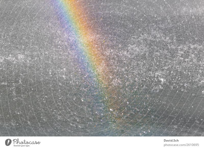 Rainbow in the fountain Water Drops of water Fountain Multicoloured Yellow Green Violet Orange Prismatic colors Colour photo Exterior shot Copy Space left