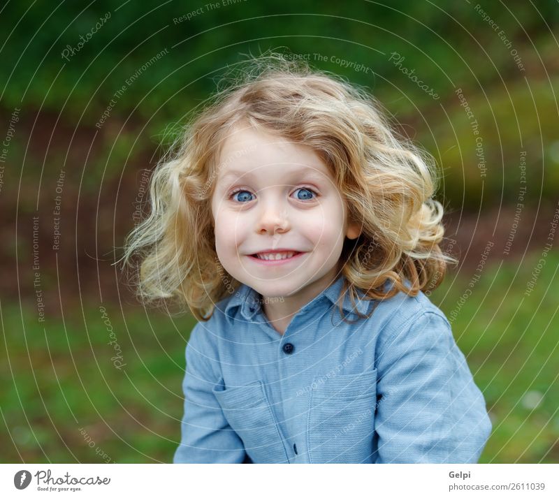 Happy small child with long blond hair Beautiful Face Summer Child Human being Baby Boy (child) Man Adults Infancy Environment Nature Plant Shirt Blonde Smiling