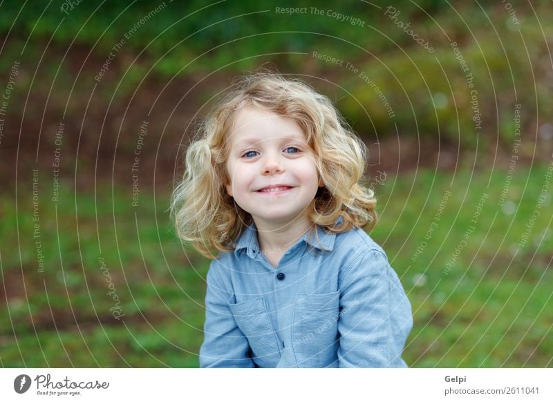 Happy small child with long blond hair Beautiful Face Summer Child Human being Baby Boy (child) Man Adults Infancy Environment Nature Plant Shirt Blonde Smiling