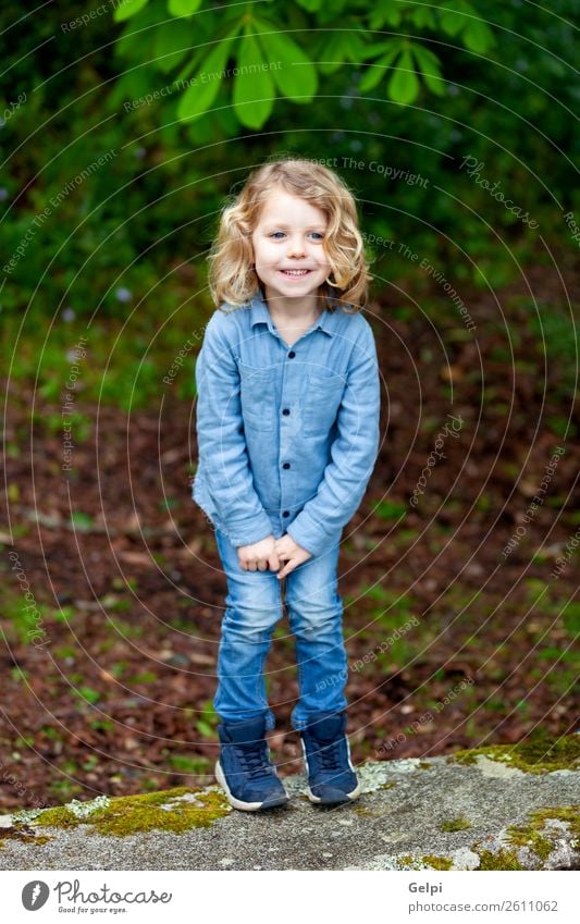 Happy small child with long blond hair Beautiful Face Summer Child Human being Baby Boy (child) Man Adults Infancy Environment Nature Plant Shirt Blonde Smiling