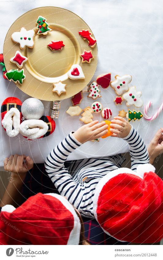 Mother and son decorating Christmas biscuits at home Cake Dessert Candy Lifestyle Joy Happy Beautiful Leisure and hobbies Children's game Winter