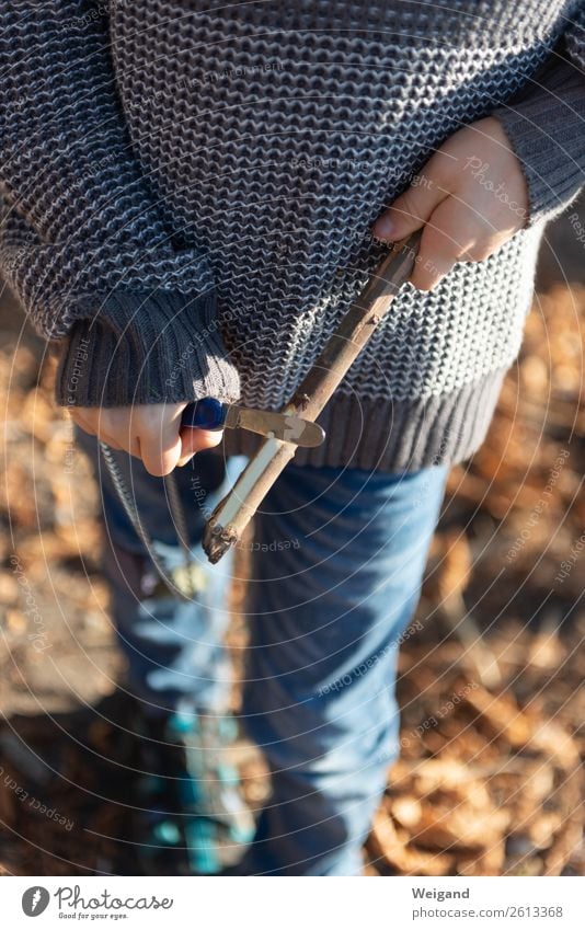 tent camp Tree Park Forest Hunting Fresh Brown Tent camp Knives Carve Boy (child) Infancy Adventure Stick Point Colour photo Shallow depth of field