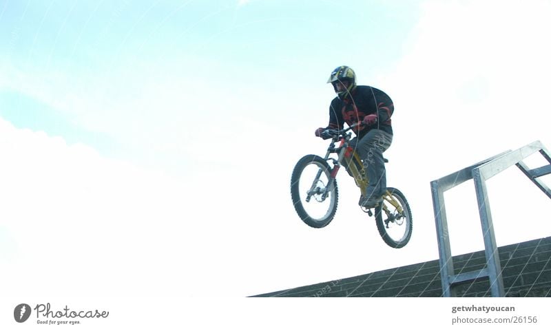 Jump on stairs Bicycle Man Helmet Brave Horizon Protective equipment Speed Far-off places Back-light Extreme sports Stairs Handrail Tall Bright Blue Flying