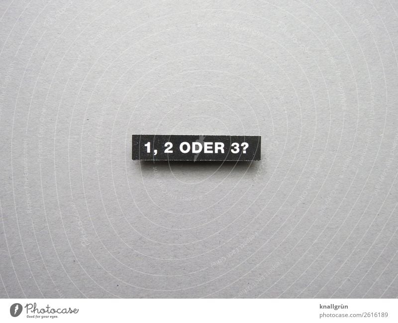 One, two or three? Characters Signs and labeling Select Communicate Gray Black White Emotions Curiosity Interest Expectation Decide Indecisive Colour photo