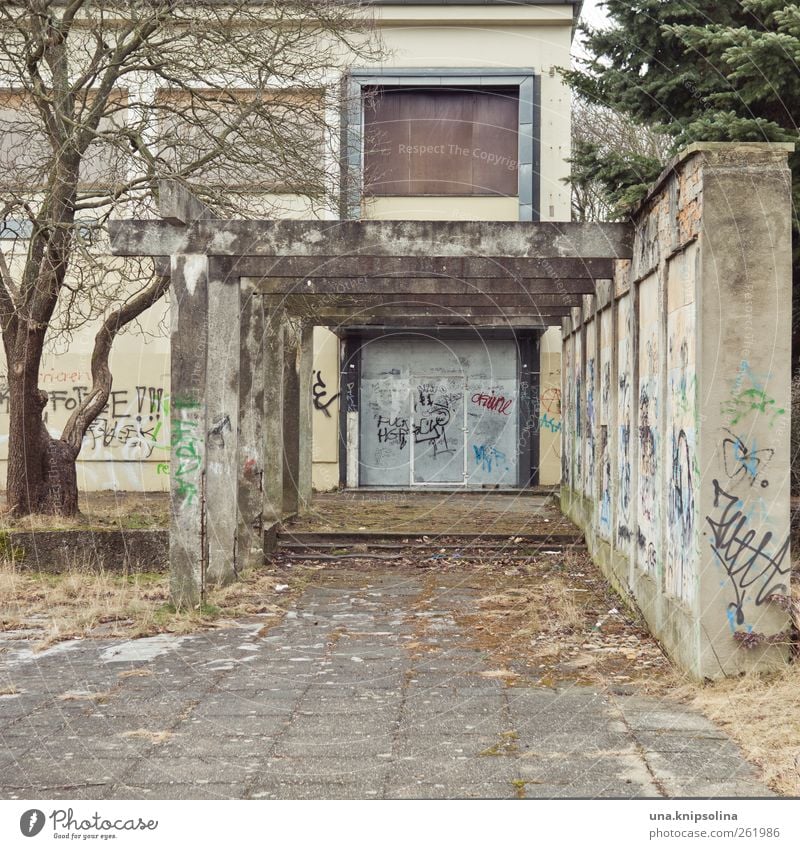 culture Hoyerswerda GDR Outskirts Ruin Building Wall (barrier) Wall (building) Window Door pergola Concrete Graffiti Old Dirty Sharp-edged Broken Gloomy Concern