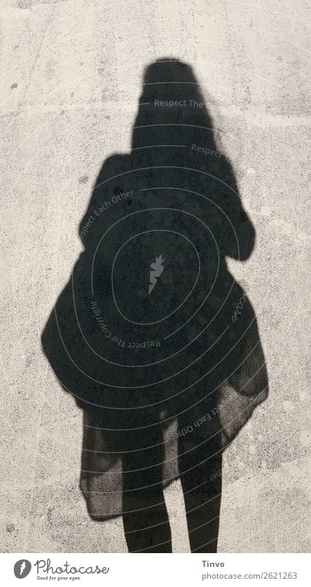 Shadow of a woman in a summer dress / Summer is casting its shadows Shadow image Black and white photography Light and shadow Sunlight Exterior shot Contrast