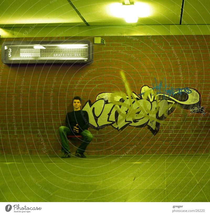 graffiti sux 2 Green Painting and drawing (object) Human being Graffiti Train station Sit Seating Display