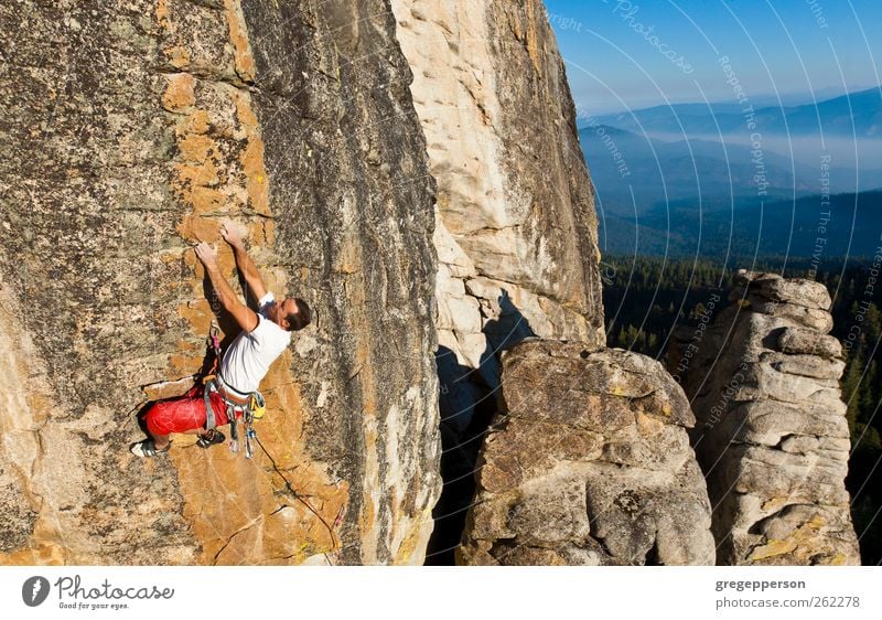 Climber clinging to a cliff. Life Adventure Climbing Mountaineering Rope Man Adults 1 Human being 18 - 30 years Youth (Young adults) Rock Athletic