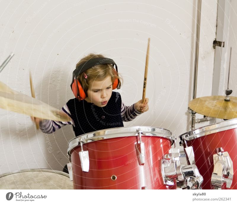 rock concert girl Child Toddler Infancy Playing Joy Drum set Music Musical instrument headphones Ear protectors Leisure and hobbies Make music play music Sound