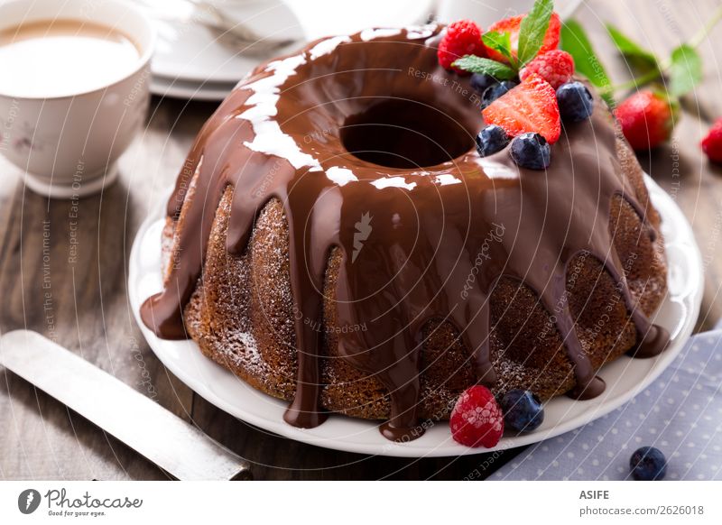 Chocolate bundt cake with berries Fruit Dessert Breakfast Hot Chocolate Coffee Tea Birthday Leaf Wood Fresh Brown chocolate glaze Berries Strawberry Blackberry