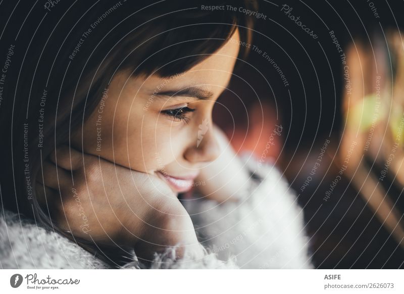 Dreamy and happy little girl looking through the window. Shallow depth of field Joy Happy Beautiful Winter Child Infancy Autumn Warmth Brunette Observe Smiling