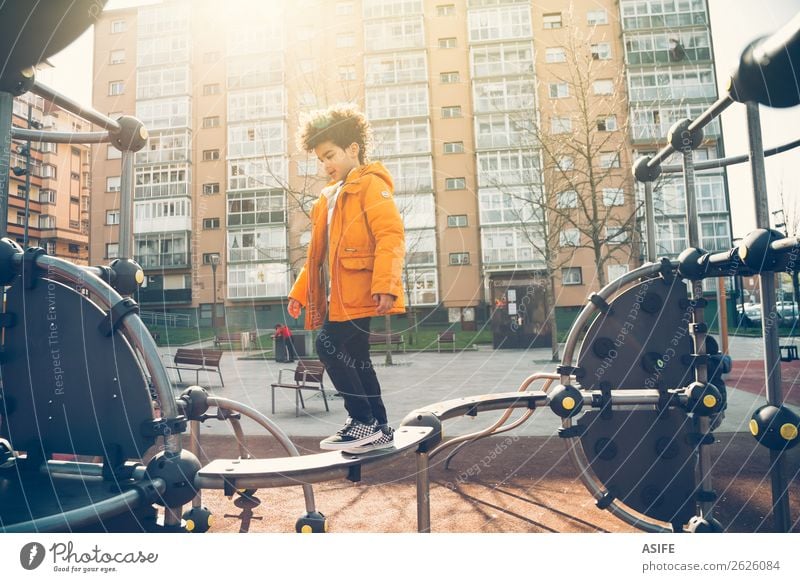 Little boy playing in the balance bar in a playground Joy Happy Leisure and hobbies Playing Winter Climbing Mountaineering Child Boy (child) Man Adults Infancy