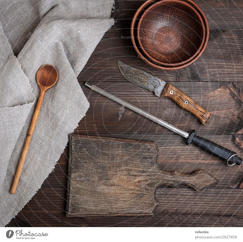 old brown wooden cutting board Plate Bowl Knives Spoon Table Kitchen Nature Wood Old Retro Brown knife background Blank chopping cook cooking Cut empty food