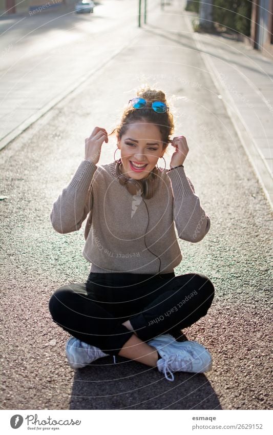 Happy Young woman in street Lifestyle Joy Youth (Young adults) 1 Human being Music Listen to music Village Small Town Smiling Laughter Friendliness Happiness