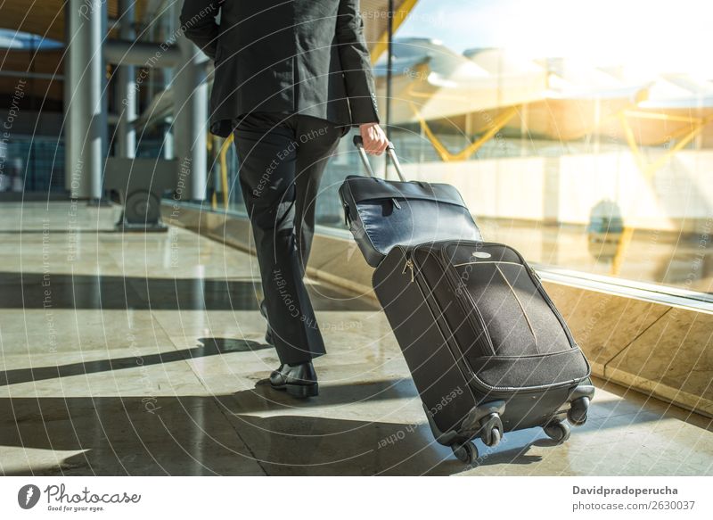 businessman back and legs walking with luggage at the airport Airport Businessman Back Walking Legs Luggage step Window Departure lounge Suit Man