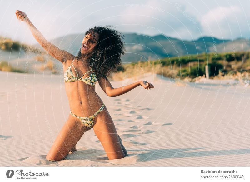 Beautiful young woman posing on the sand in the beach Beach Sand pose Woman Human being Isolated romantic Ocean Sun Vacation & Travel Nature Swimming Suit Joy