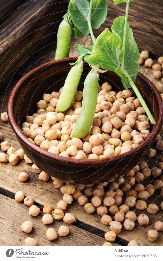 Uncooked chickpeas grains in bowl healthy food bean vegetable vegetarian organic turkish peas natural ingredient nutrition indian closeup seed legume protein