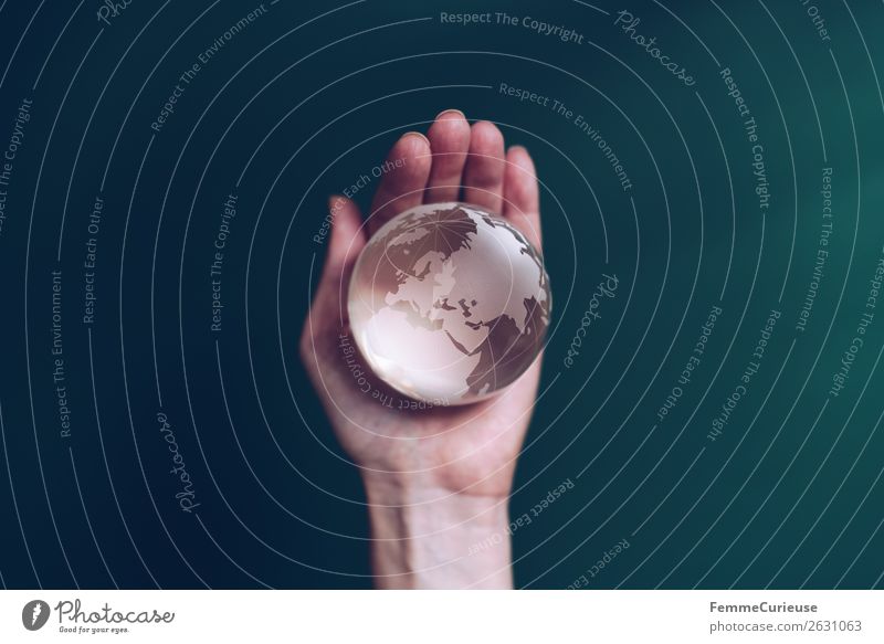 Hand with transparent globe in front of green background Climate Horizon Earth Globe Transparent To hold on Fingers Dark green Europe Africa Saudi Arabia