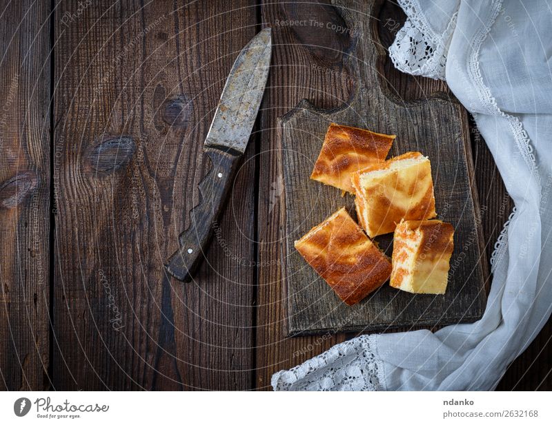 square pieces of cheesecake with pumpkin Cheese Dessert Nutrition Eating Breakfast Knives Table Autumn Fresh Delicious Brown Tradition background Baking cream