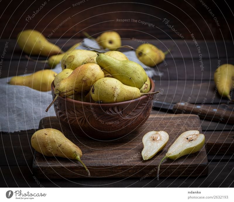 ripe green pears in a brown clay bowl on a table Fruit Nutrition Vegetarian diet Diet Bowl Table Group Nature Wood Old Eating Fresh Delicious Natural Above