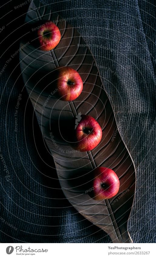 Red apples on a wooden tray in low light Fruit Apple Healthy Eating Autumn Wood Dark Fresh Delicious Natural Retro above view context food healthy Ingredients