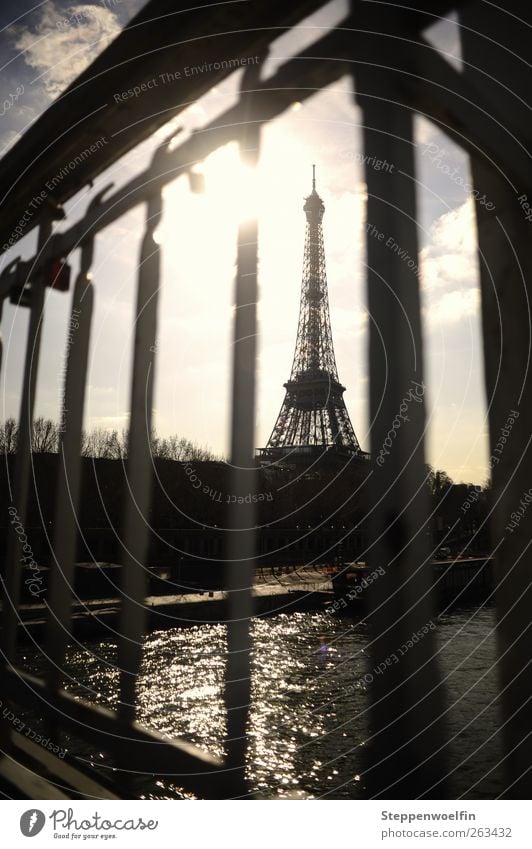 Eiffel Tower behind bars Paris France Europe Town Capital city Downtown Skyline Deserted Bridge Tourist Attraction Landmark Steel Rust To enjoy Blue Gray Art