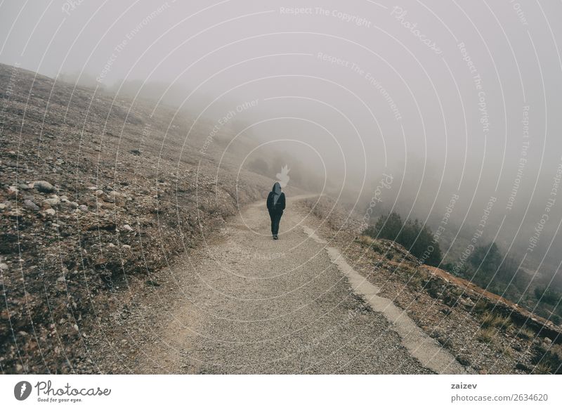 Girl walking on her back on a mountain road with a lot of fog Lifestyle Beautiful Vacation & Travel Tourism Trip Adventure Freedom Mountain Hiking Human being