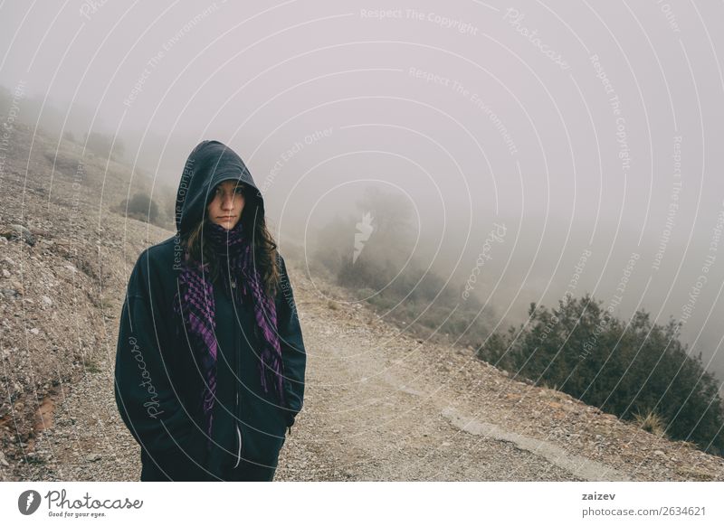 Girl with hood in a mountain landscape with a lot of fog Lifestyle Beautiful Vacation & Travel Tourism Trip Adventure Winter Hiking Human being Woman Adults