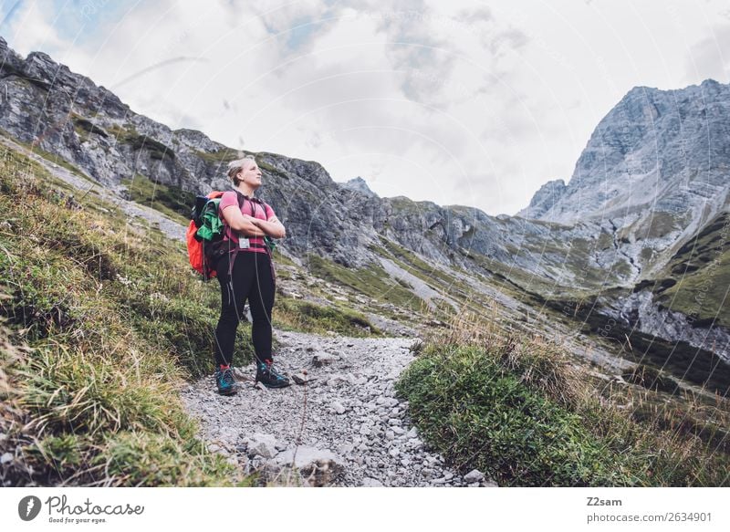 Young woman crossing the Alps Leisure and hobbies Vacation & Travel Adventure Hiking Youth (Young adults) 18 - 30 years Adults Nature Landscape Rock Mountain