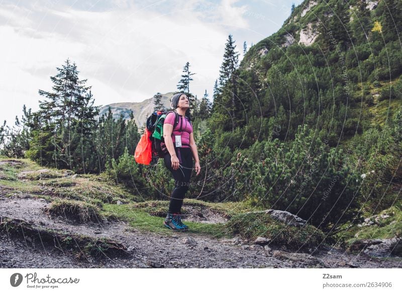 Young woman crossing the Alps Vacation & Travel Adventure Freedom Hiking Youth (Young adults) 18 - 30 years Adults Nature Landscape Forest Mountain