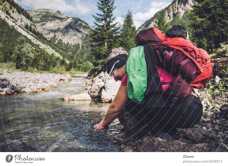 Young woman refreshes herself while hiking Vacation & Travel Adventure Hiking Youth (Young adults) 18 - 30 years Adults Nature Landscape Beautiful weather