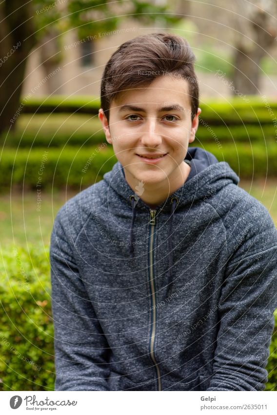 Pensive teenager guy in a park Lifestyle Style Beautiful Hair and hairstyles Face Calm Summer Human being Boy (child) Man Adults Youth (Young adults) Nature